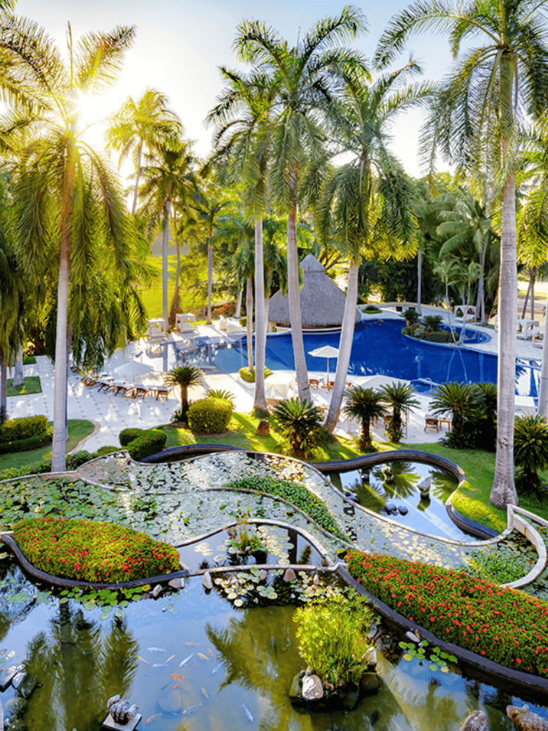 Relaxing tropical resort with palm trees and water features, perfect for a vacation retreat.