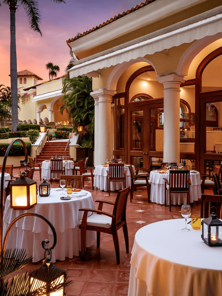 Elegant outdoor restaurant with sunset view at Quest For Directions.