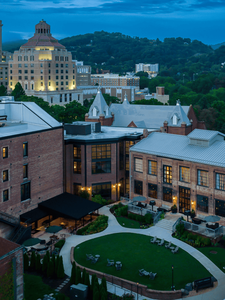 Historic downtown architecture with lush hills in the background, ideal for city and nature exploration.