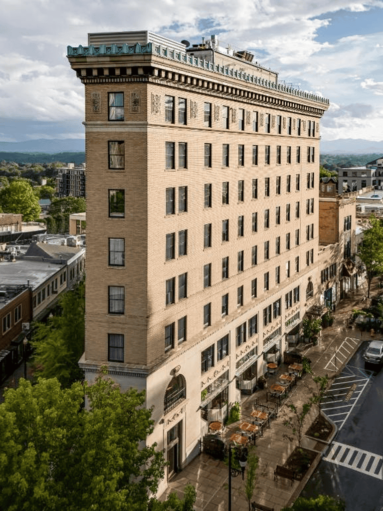 Cozy downtown hotel with rooftop amenities and nearby parking.