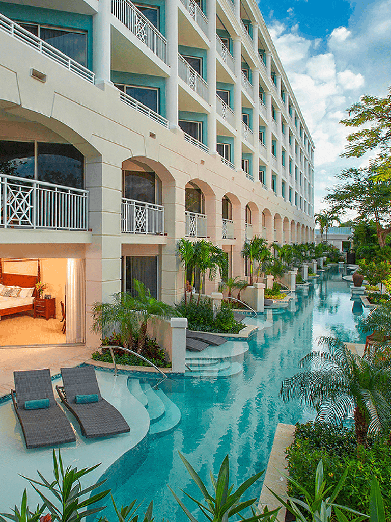 Luxurious hotel with poolside views and tropical landscaping at QuestForDirections.