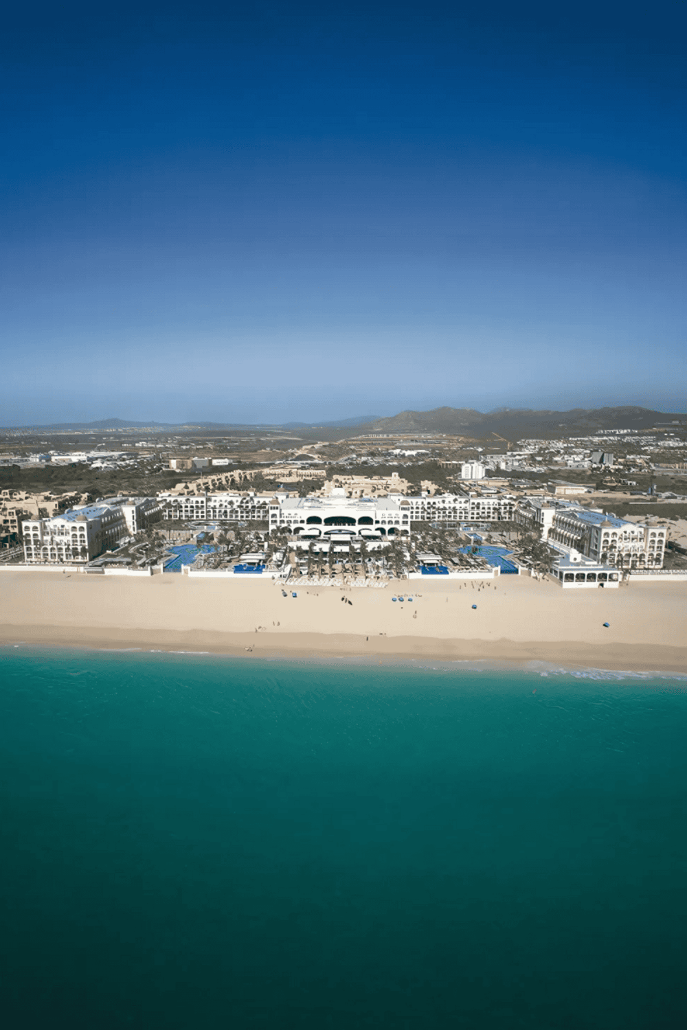 Resort beachfront with luxury accommodations and scenic ocean views in QuestForDirections.