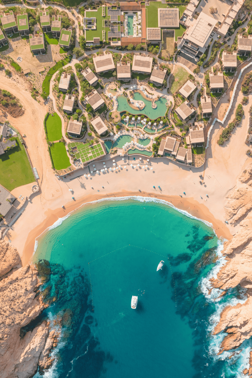Luxurious beachside resort with swimming pools and ocean access. Perfect vacation destination with scenic views.