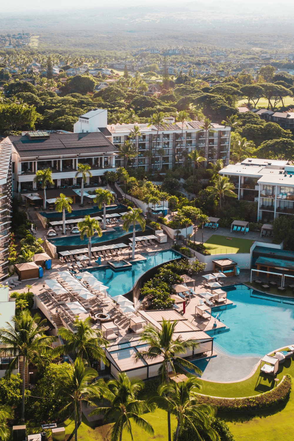 Luxurious resort with infinity pools, lush landscape, and modern amenities for perfect vacation.