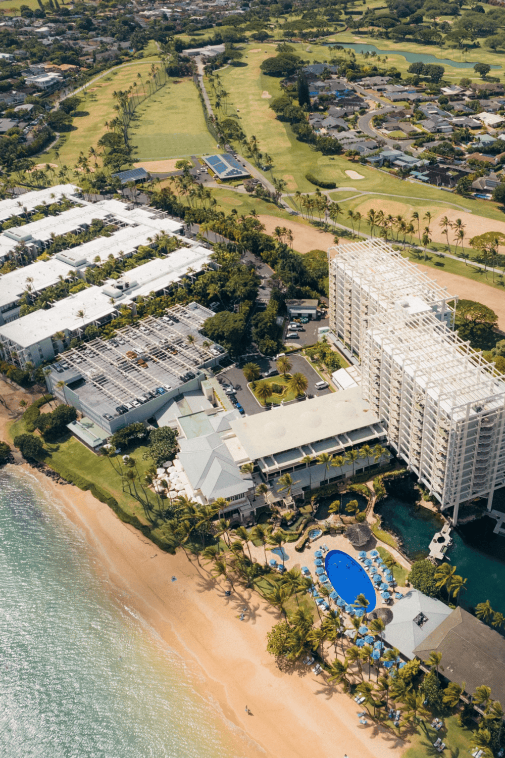 Luxury beachfront resort with pool and ocean views.