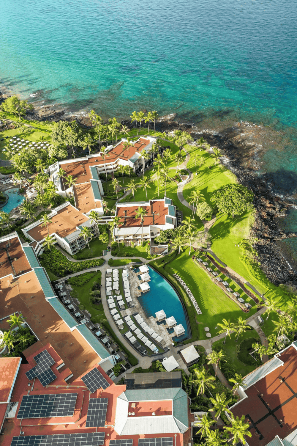 Luxurious coastal resort with infinity pool, lush gardens, and ocean views.