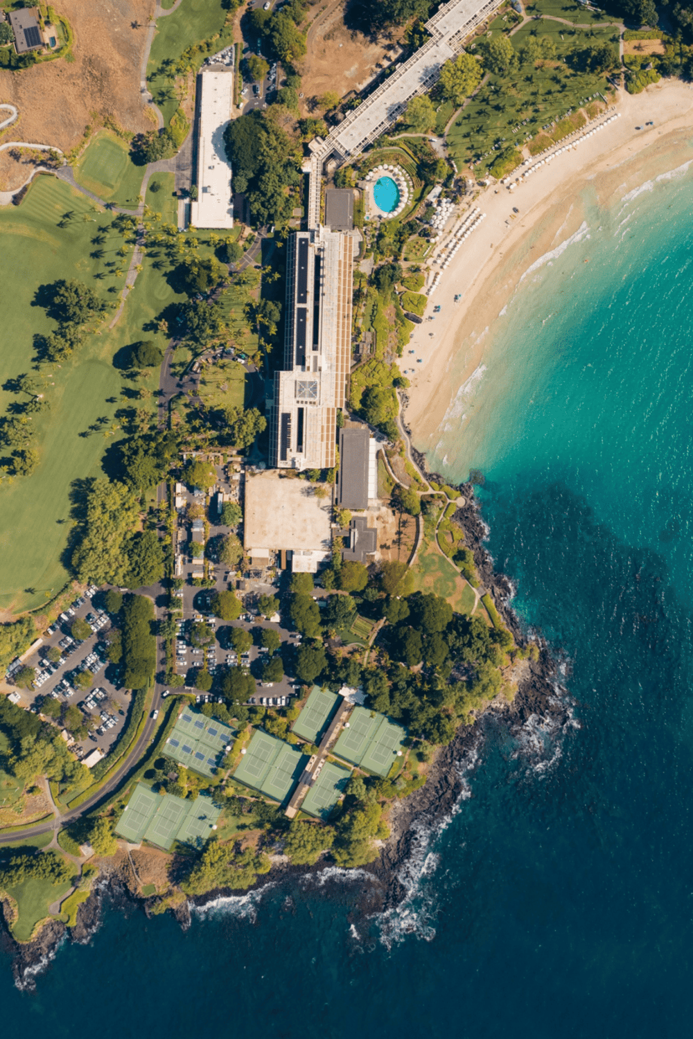Luxury oceanfront resort with pools and tennis courts at the beach.