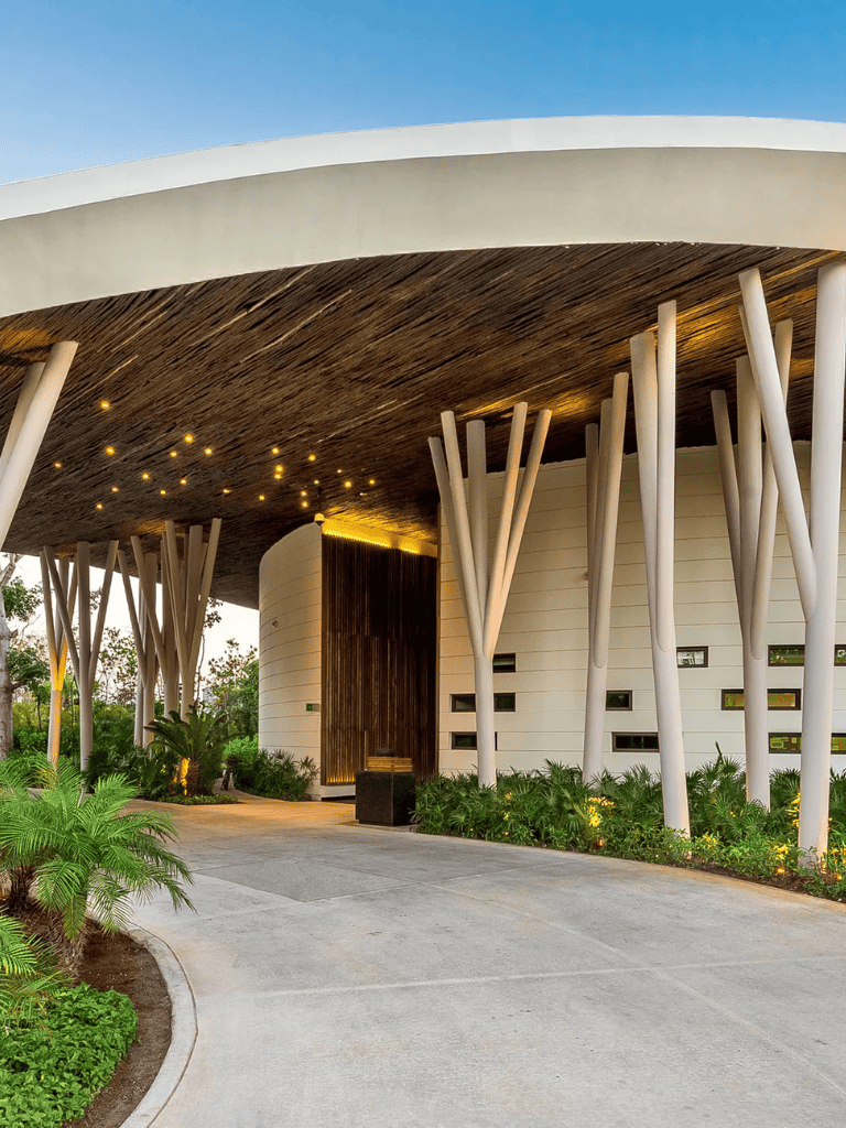 Modern architectural building with wooden accents and unique tree-like pillars, part of QuestForDirections.