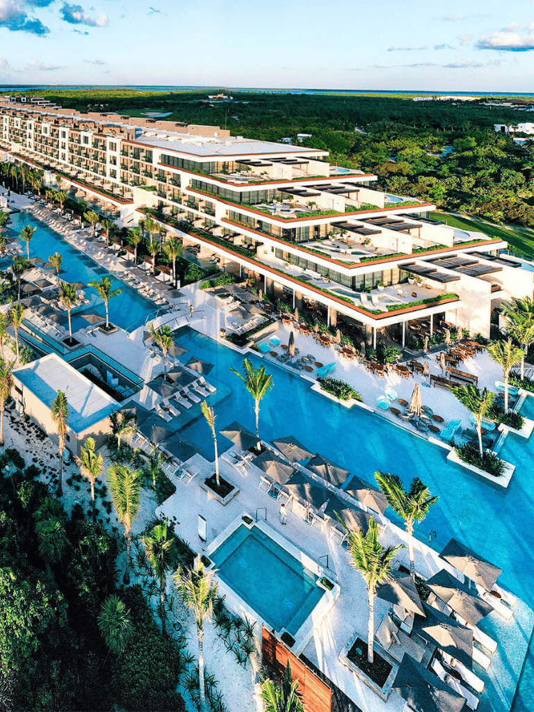 Luxury resort with infinity pool and tropical surroundings, perfect for vacation planning and relaxation.