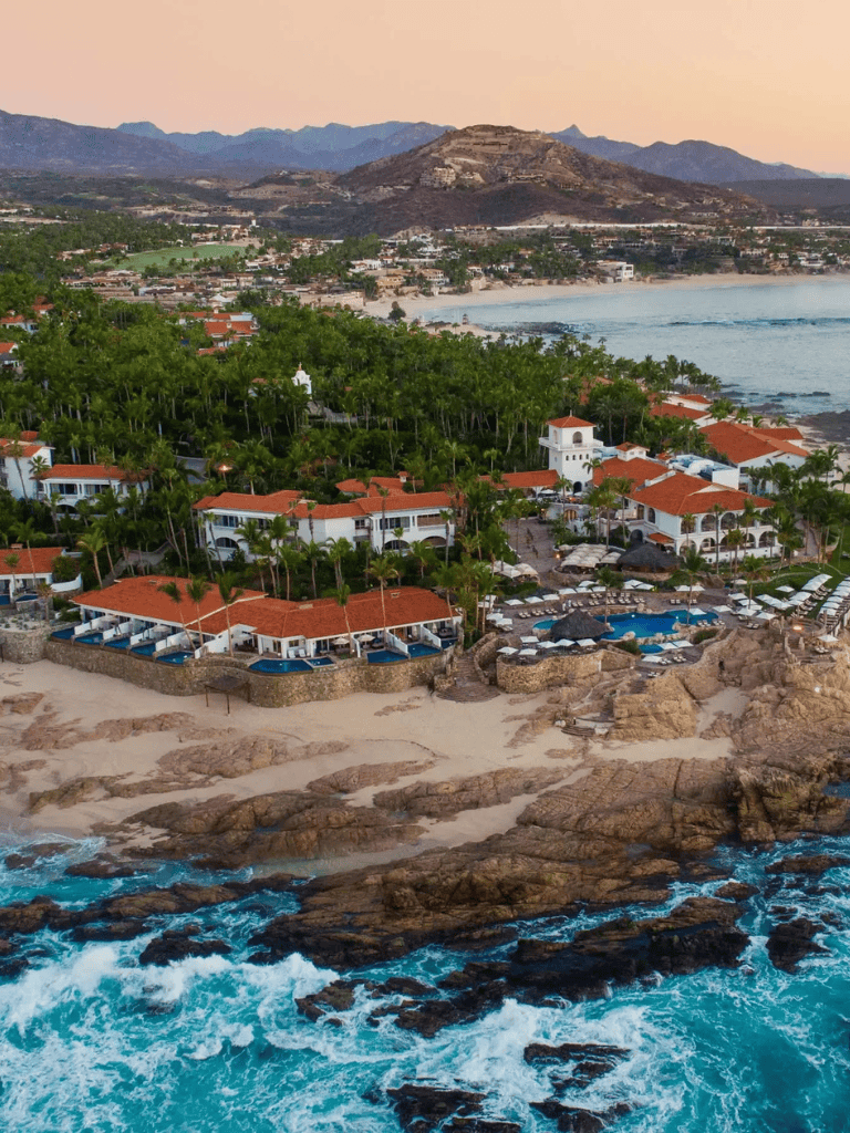 Stunning coastal resort with ocean views, sandy beaches, and lush greenery in a scenic seaside setting.