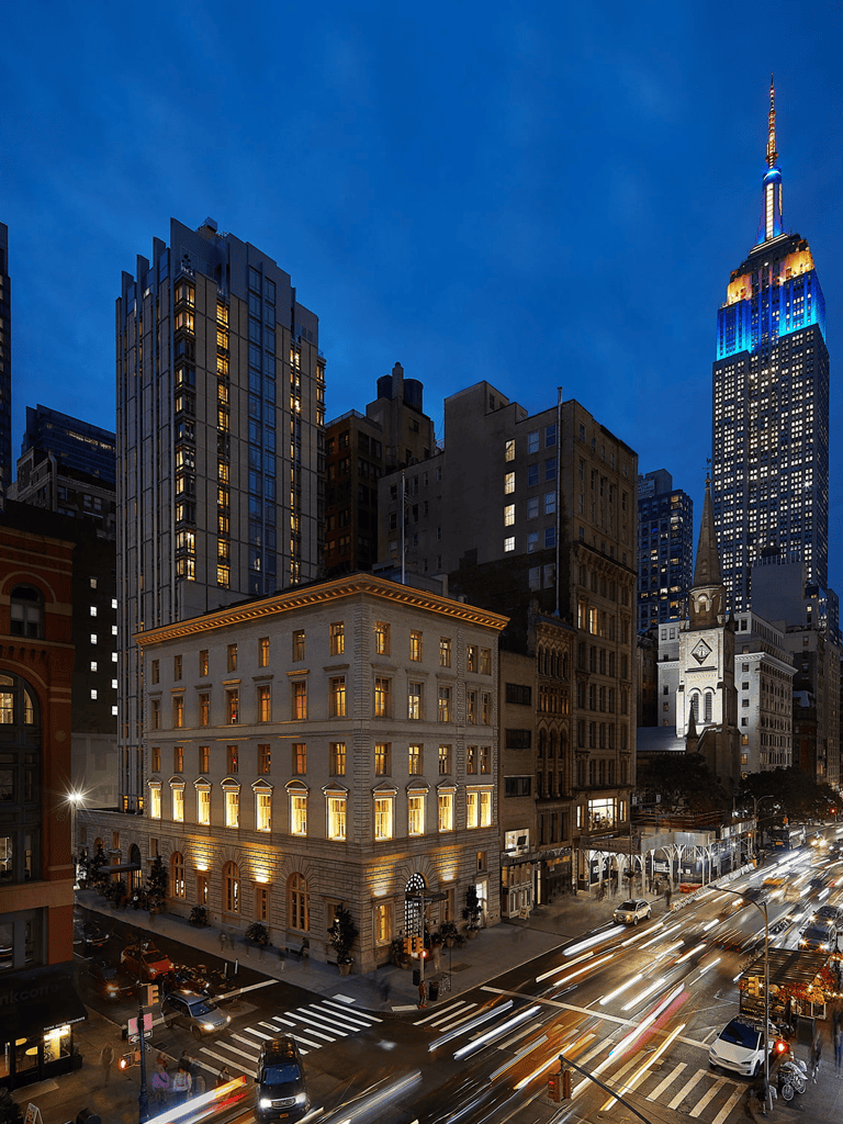 1. NYC cityscape at dusk with Empire State Building illuminated.