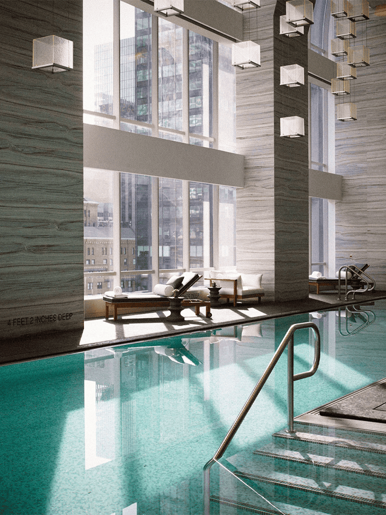 Indoor luxury pool with modern high-rise city view, stylish lounge chairs, and natural sunlight streaming in.