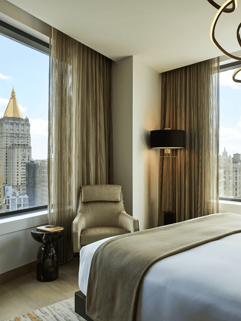 Comfortable hotel room with city views and elegant furnishings.