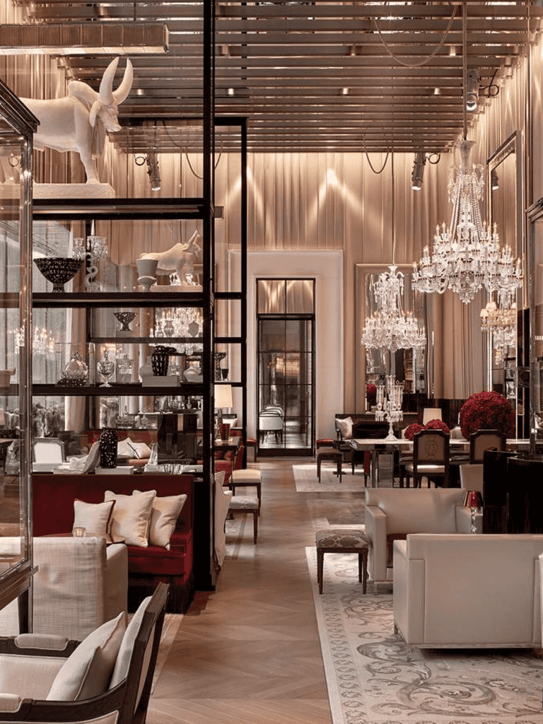 Elegant hotel lobby with chandeliers, plush seating, and decorative decor for luxury guest experience.