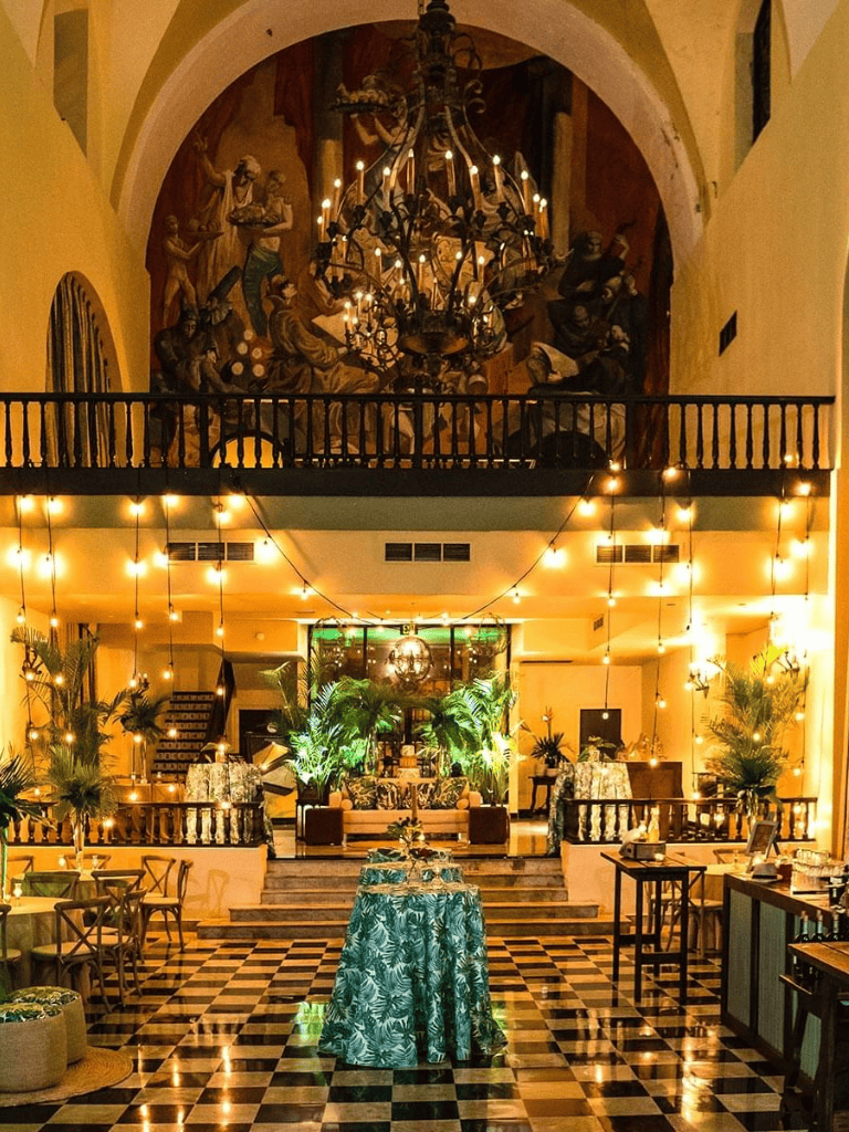 Luxurious hotel lobby with elegant lighting and tropical decor, perfect for upscale events and gatherings.