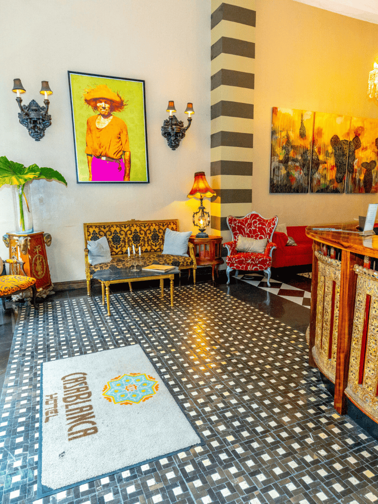 Elegant hotel lobby with vibrant artwork and stylish seating area, designed for guest comfort and aesthetic appeal.