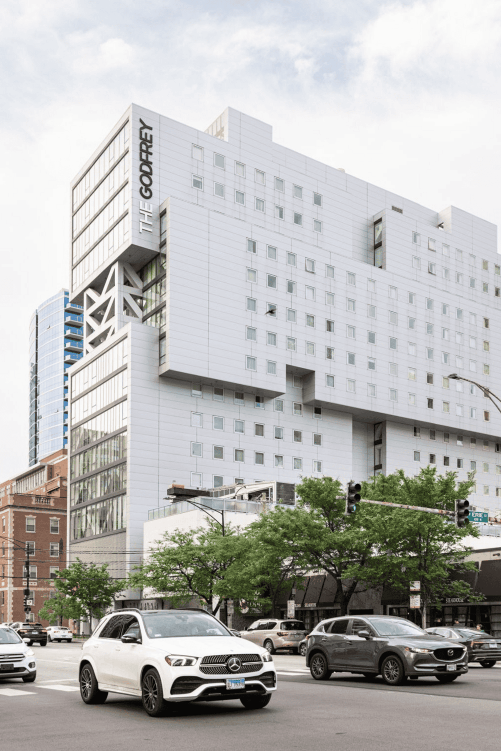 Vibrant downtown cityscape with modern architecture and active traffic scene.