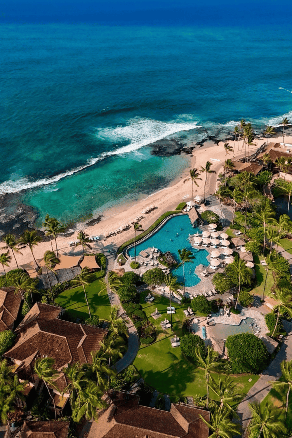Luxurious beachfront resort with infinity pool and ocean view, perfect for tropical vacation relaxation.