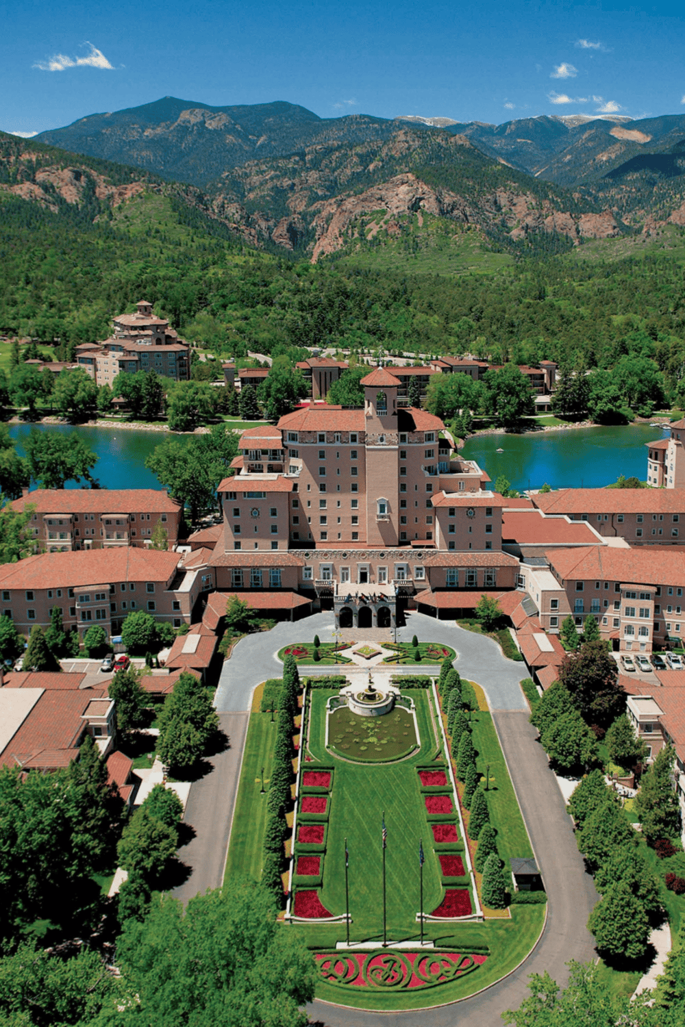 Luxury resort surrounded by mountains and a lake, offering scenic views and modern amenities.