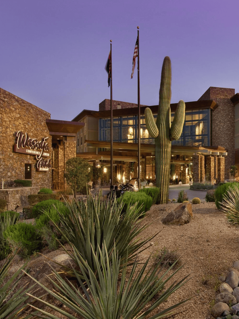 Desert landscape with cactus and modern building at Quest for Directions location.