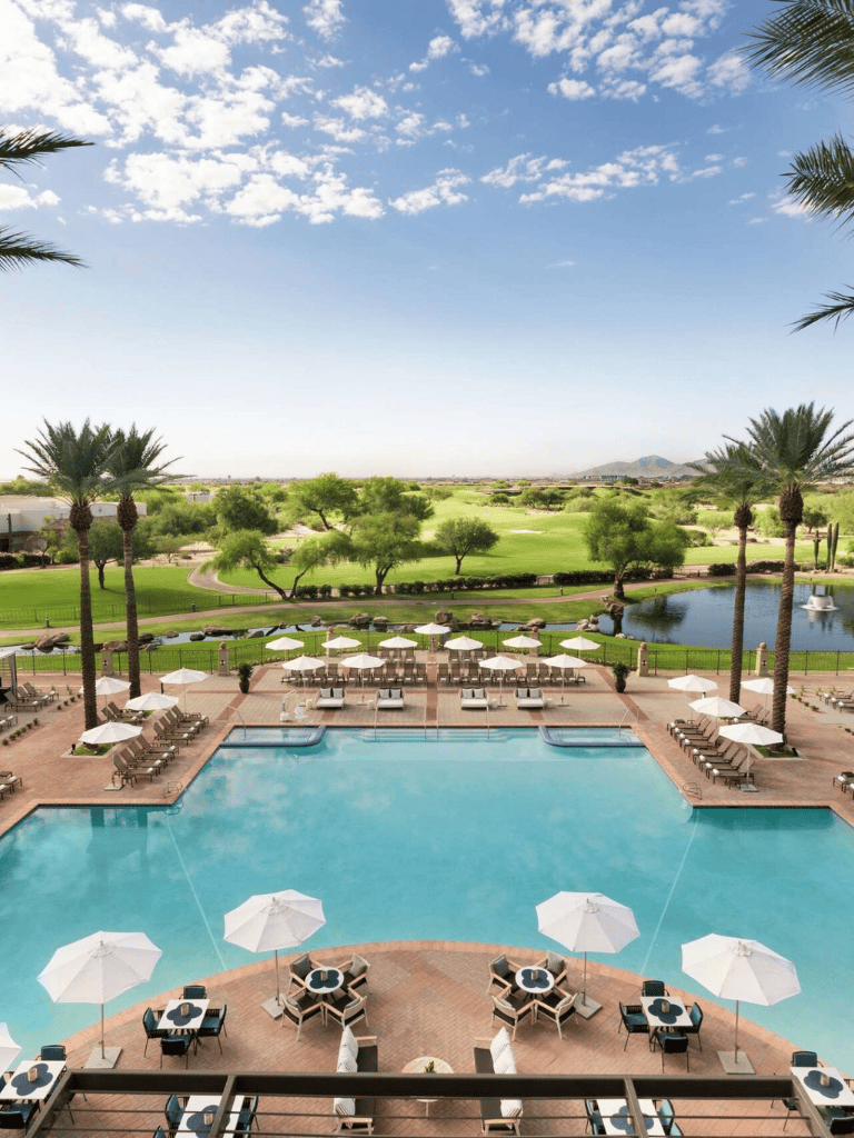 Luxurious hotel pool with scenic golf course views in Scottsdale, Arizona.