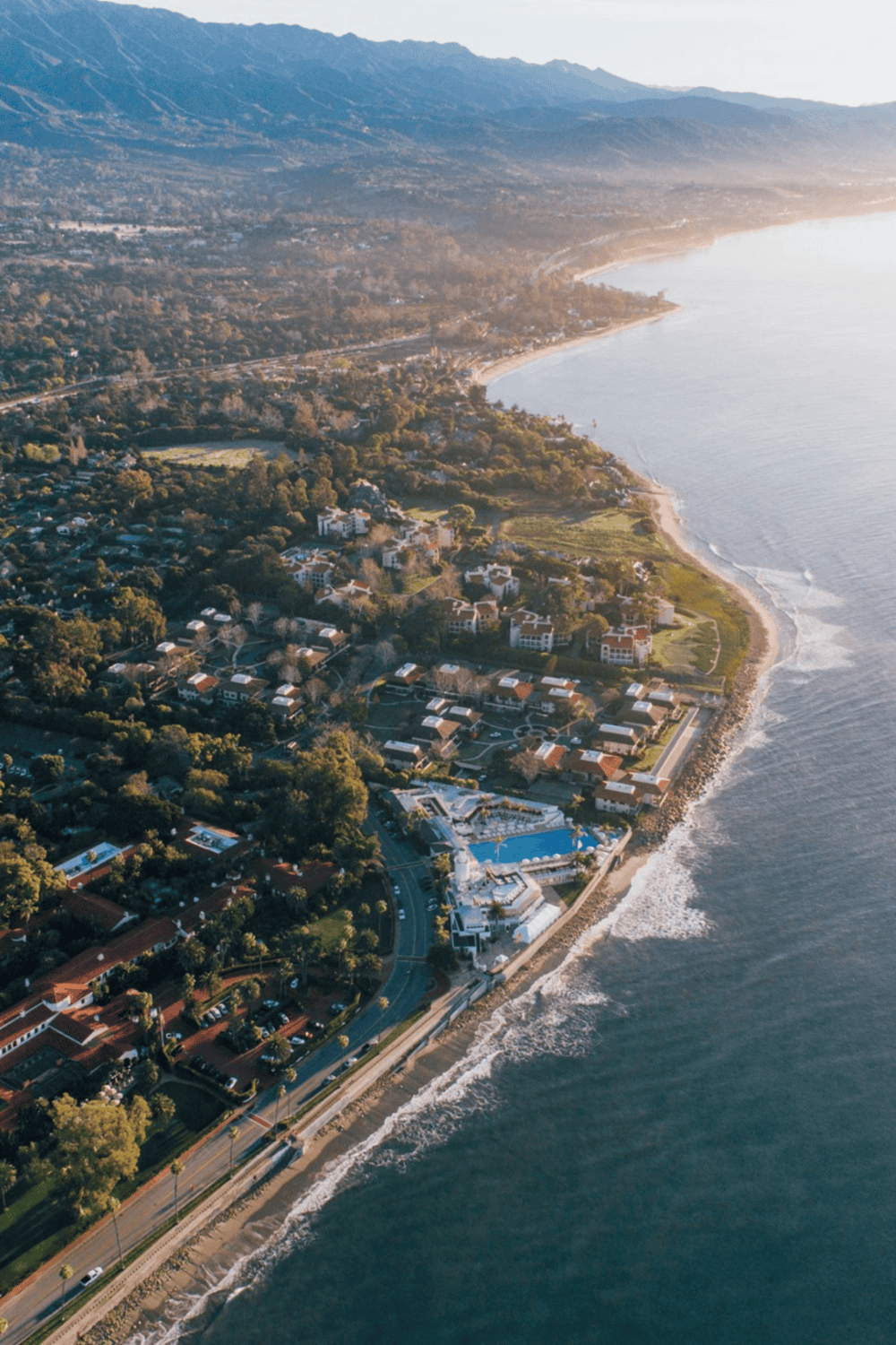 Panoramic coastal view of QuestForDirections location with beach, mountains, and scenic surroundings.