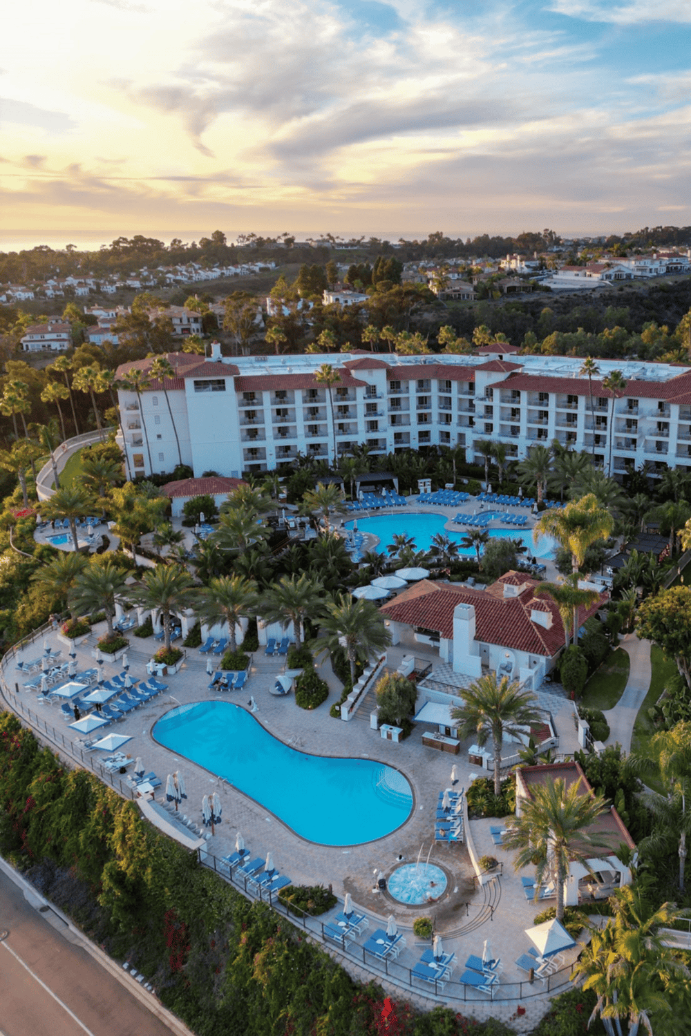 Luxury resort pool and scenic landscape background with modern amenities and lush greenery.