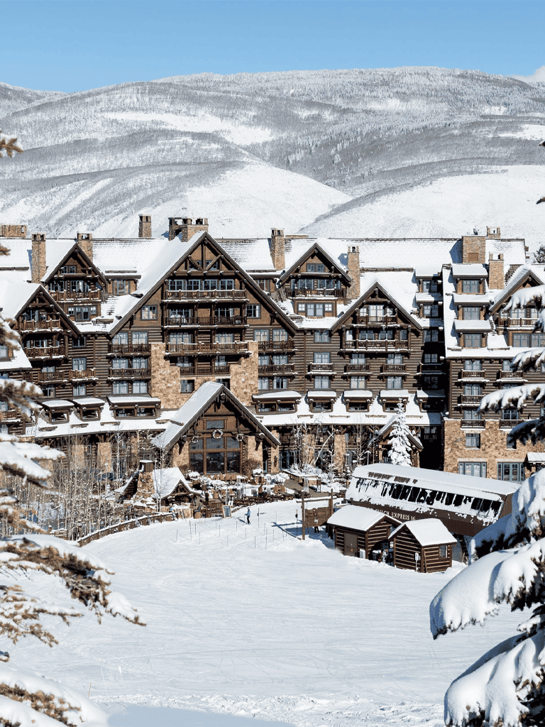 Snowy mountain resort with cozy lodges and a ski lift, perfect for winter vacations and outdoor adventures.