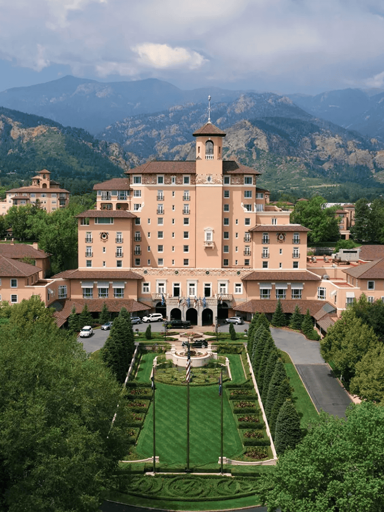 Elegant luxury hotel with scenic mountain views and beautifully landscaped gardens.