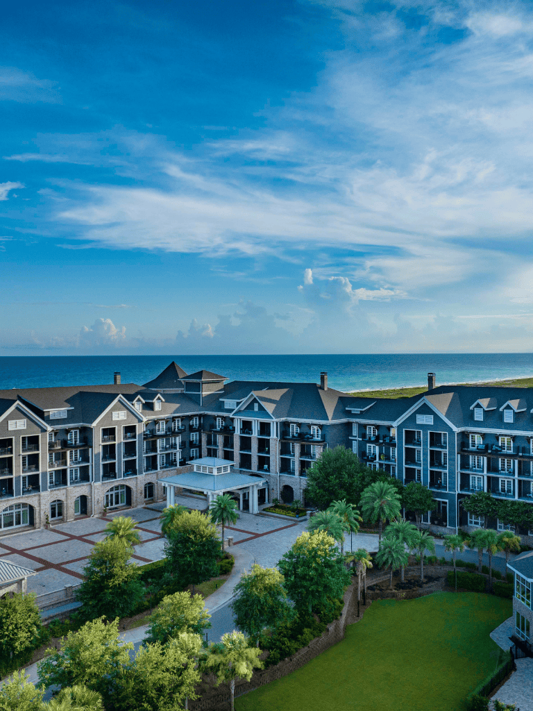 Luxurious oceanfront hotel with lush gardens and scenic sea views.