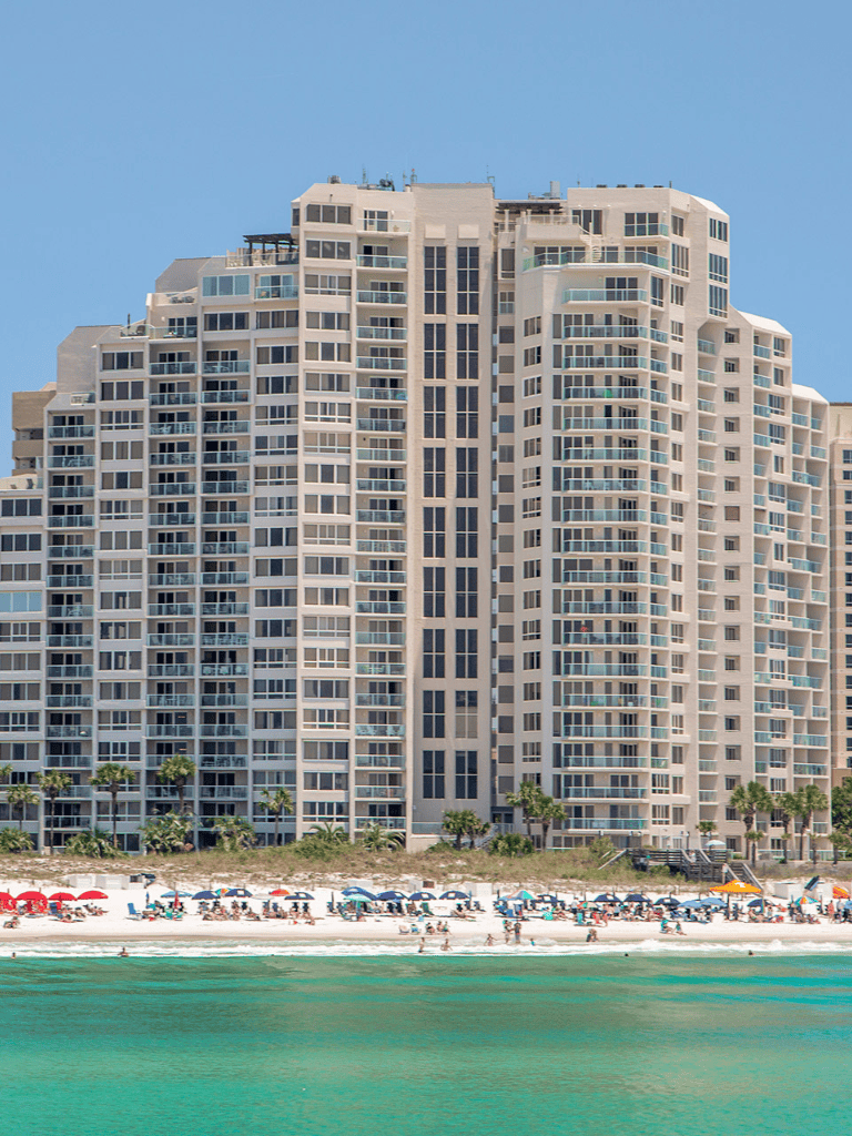 Modern beachfront high-rise resort with ocean views and beach access.