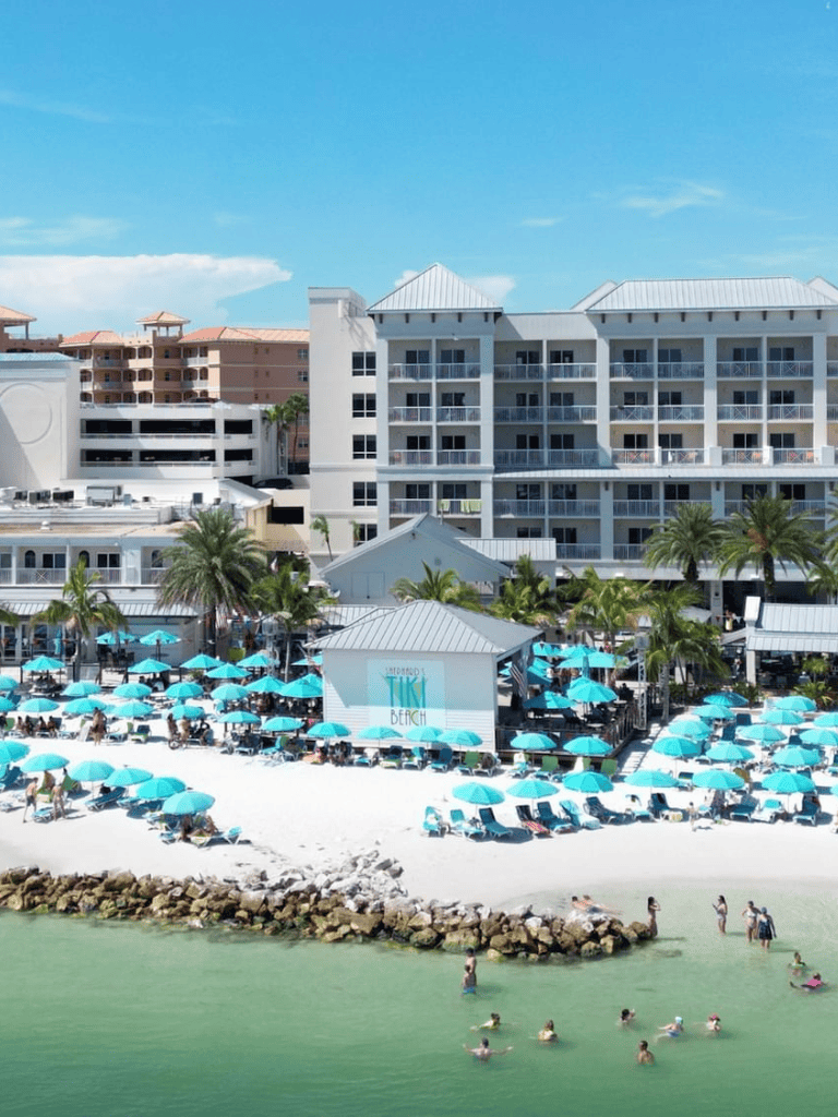 Luxurious beachfront resort with poolside umbrellas in Destin, Florida. Perfect for family vacations and relaxing getaways.