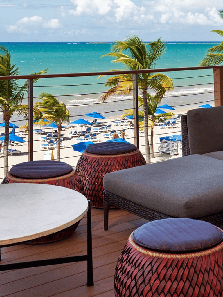 Relaxing beachfront view with palm trees, lounge chairs, and ocean scenery at QuestForDirections.
