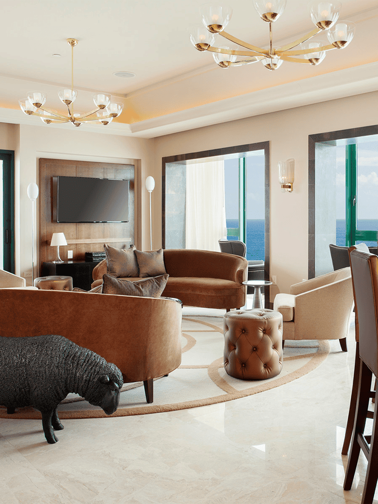 1. Modern luxury hotel living room with ocean view and stylish furniture.