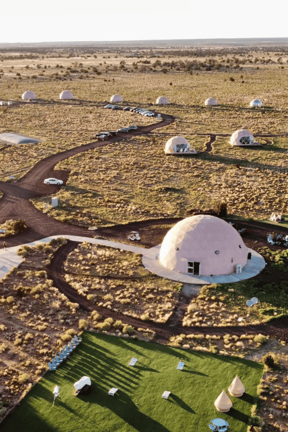 Outdoor geodesic dome accommodations with scenic desert views and modern amenities.