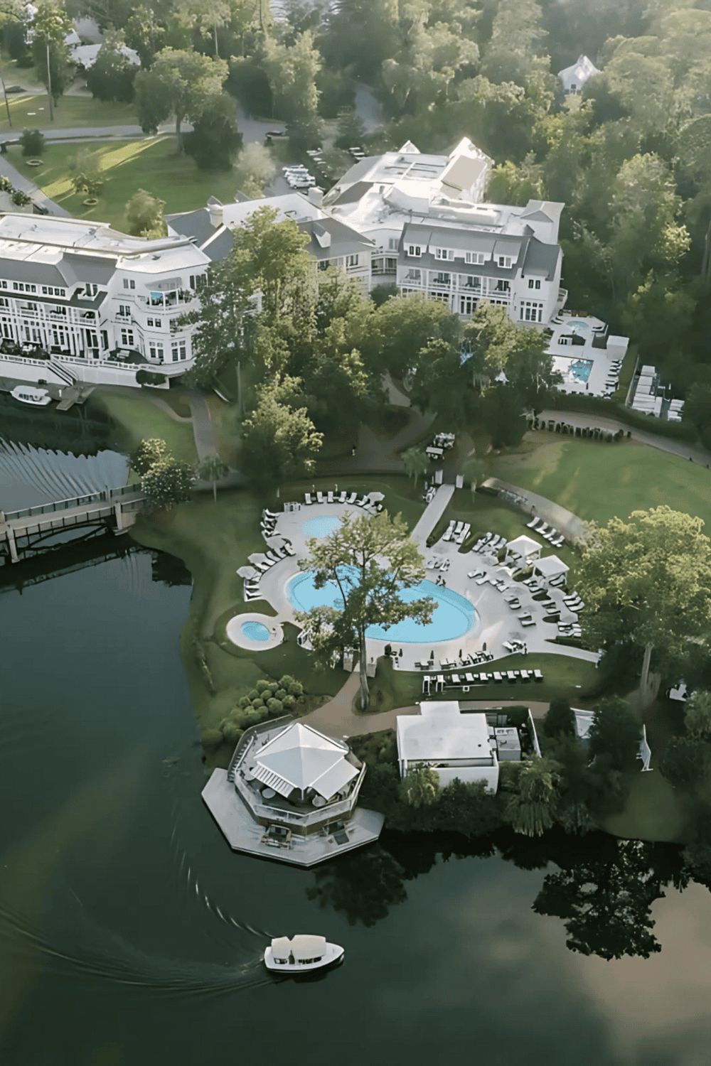 Luxury lakeside resort with pool and boat dock for relaxing vacations.