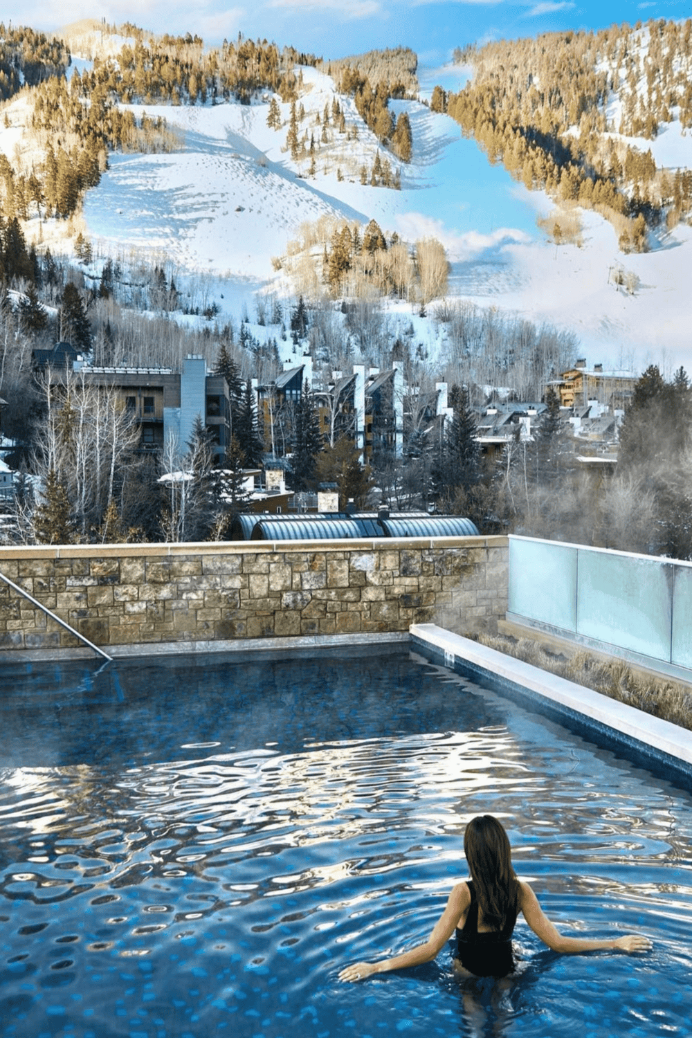 Relaxing outdoor pool overlooking snowy mountain scenery at QuestForDirections.
