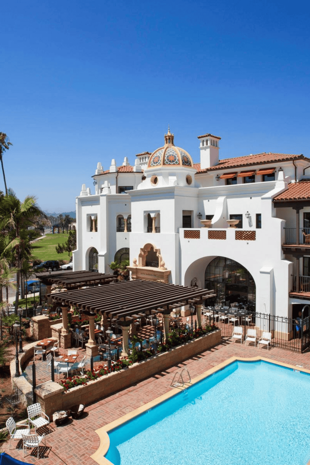 Luxury resort with Spanish-style architecture and outdoor pool at QuestForDirections.
