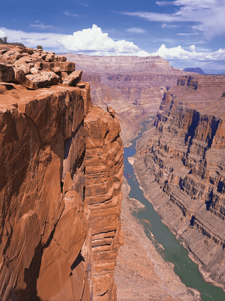 Breathtaking Grand Canyon view with rugged cliffs and flowing river, perfect for adventure travel inspiration.