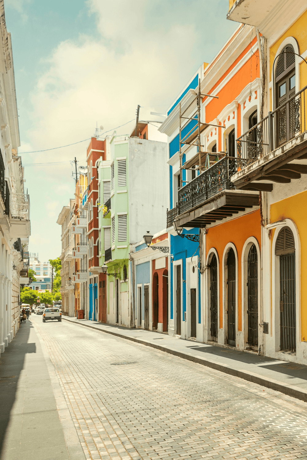 Colorful historic buildings on a sunny street in San Juan, Puerto Rico.