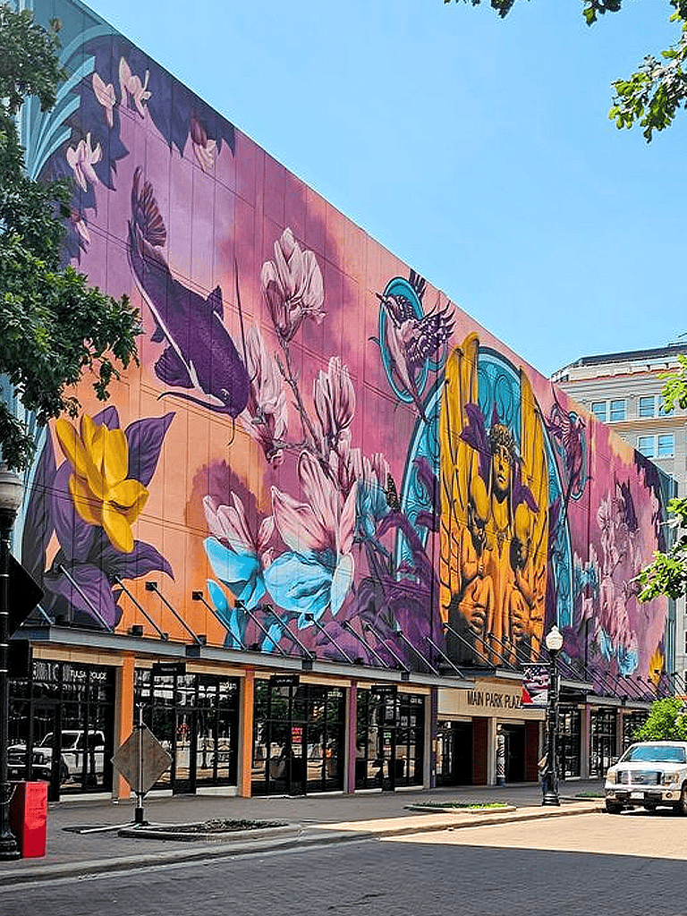 Vibrant modern mural art in downtown city street, colorful floral and abstract designs, urban public art, Quest for Directions mural.