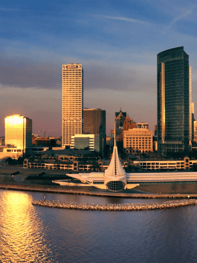 Modern city skyline with iconic architecture and waterfront view in downtown.