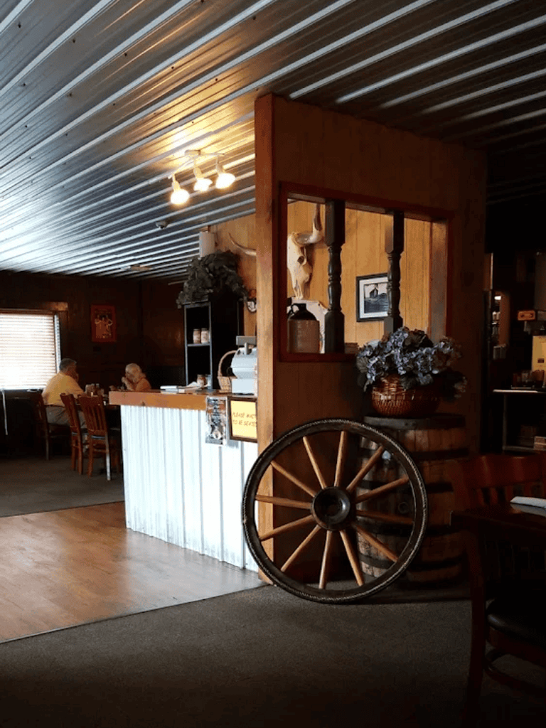 Warm cozy interior of QuestForDirections restaurant with wood decor and rustic charm.