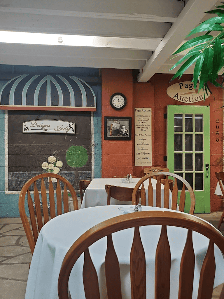 Elegant restaurant interior with wooden chairs, colorful walls, and vintage decor at QuestForDirections.