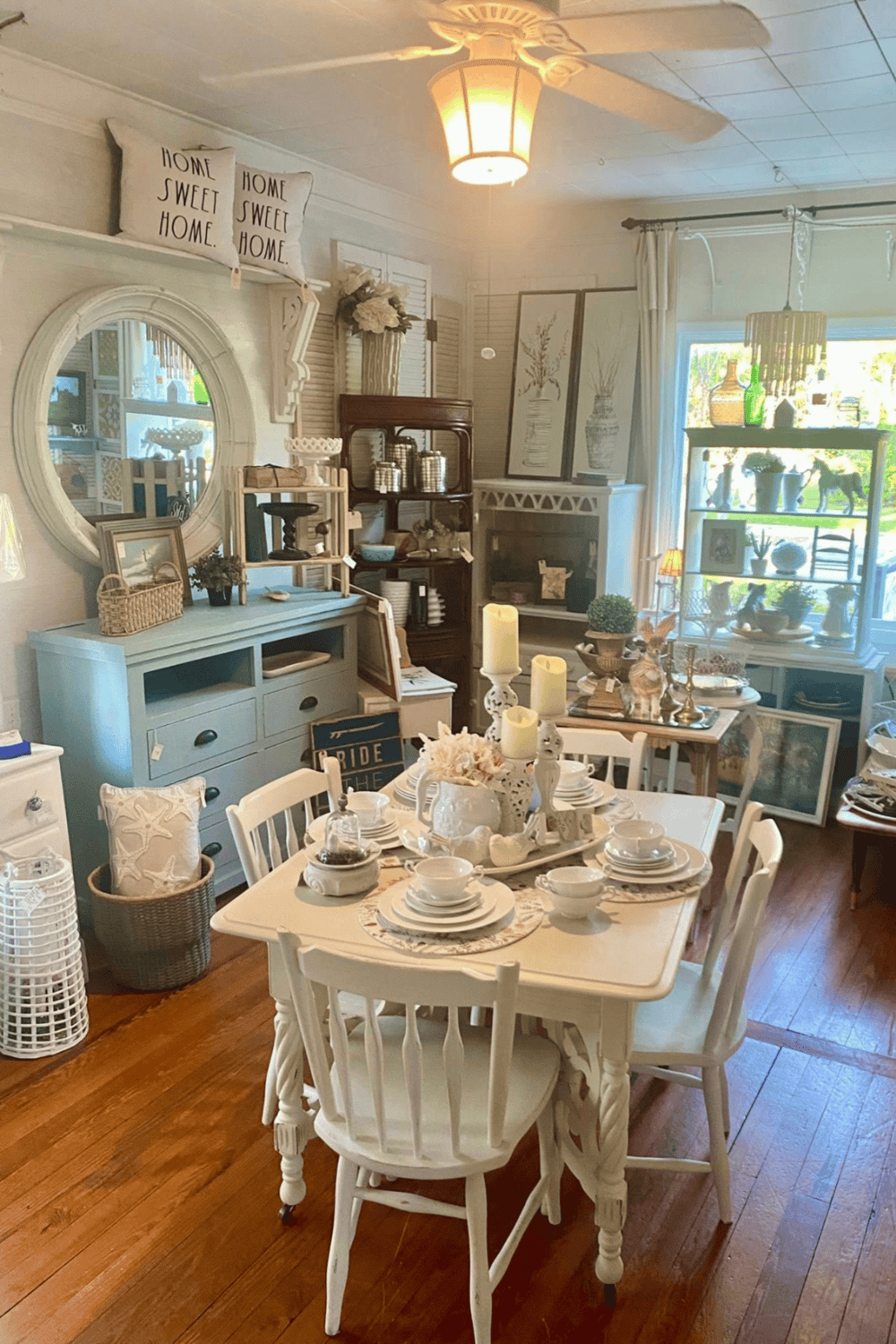 Charming farmhouse-style interior with vintage decor, cozy dining area, and eclectic accessories.