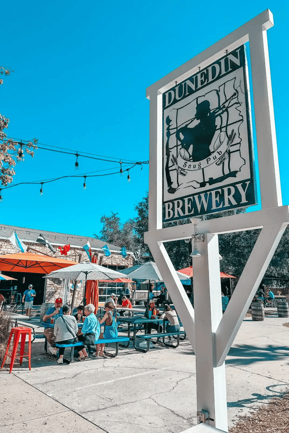 1. Alight text: Dunedin brewery promoting craft beer and outdoor beer garden experience.