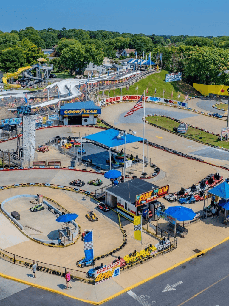 Colorful go-kart track at QuestForDirections amusement park in daytime.