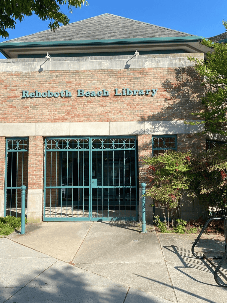 Accessible entrance at Rehoboth Beach Library with wheelchair ramp and gate.