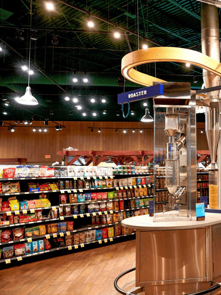 Fresh coffee beans machine at QuestForDirections grocery store.