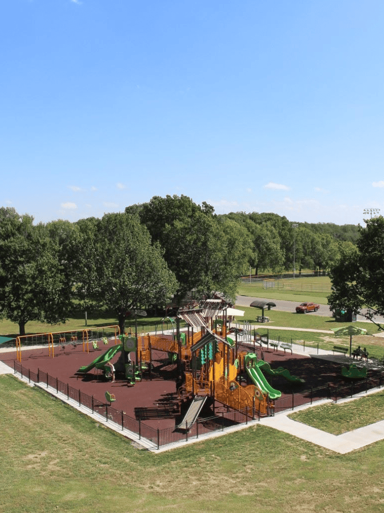 Colorful playground equipment at QuestForDirections outdoor park for children.